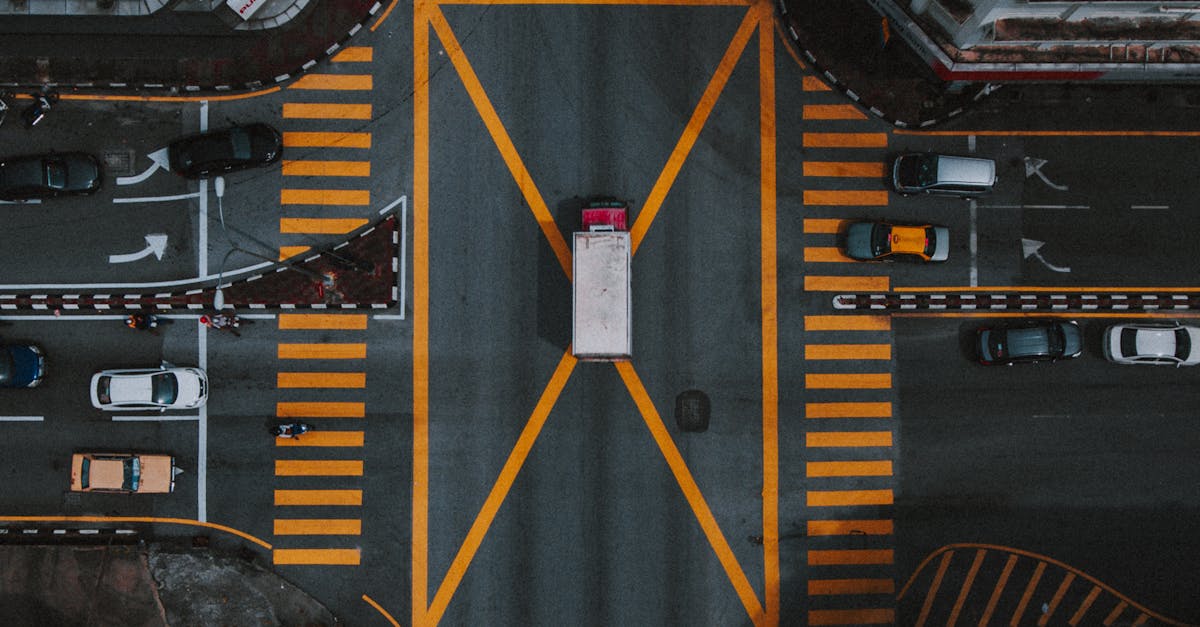 High-angle aerial view of a busy intersection in Ipoh, Malaysia, showcasing urban road layout.
