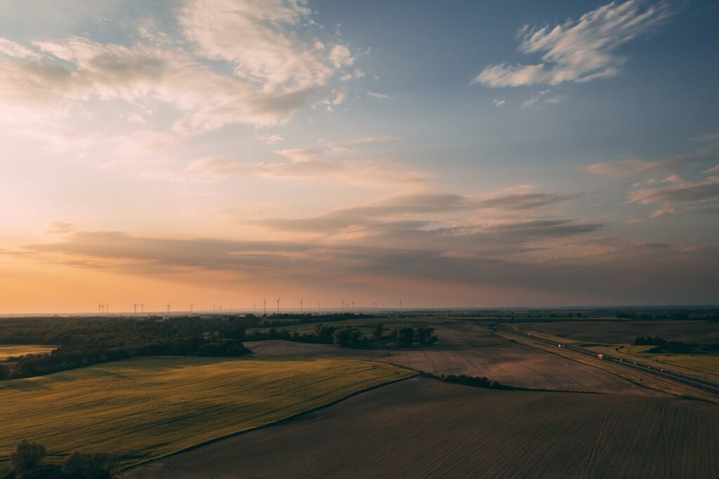 fields, countryside, sunset, sunrise, farm, rural, nature, horizon, sky, clouds, dusk, dawn, windmills, wind farm, sustainability, industry, environment, europe, panorama, aerial view, farm, sustainability, sustainability, sustainability, sustainability, sustainability